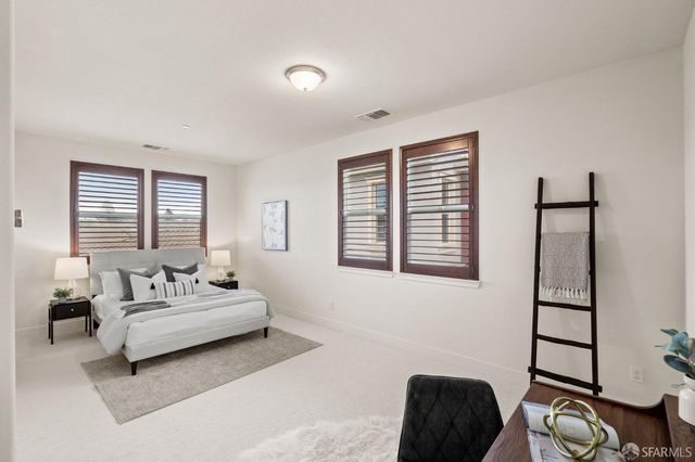 a bedroom with a bed furniture and window
