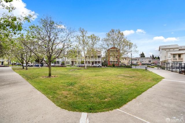 a view of a street with a building in the background