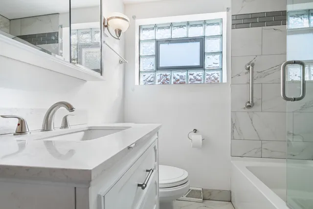 a bathroom with a sink a toilet and a bathtub