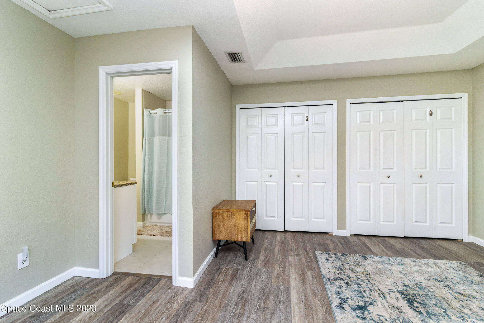950 Luminary Circle, Unit 103 Melbourne, FL 32901 - Photo 14 of 23 a view of bedroom with wooden floor