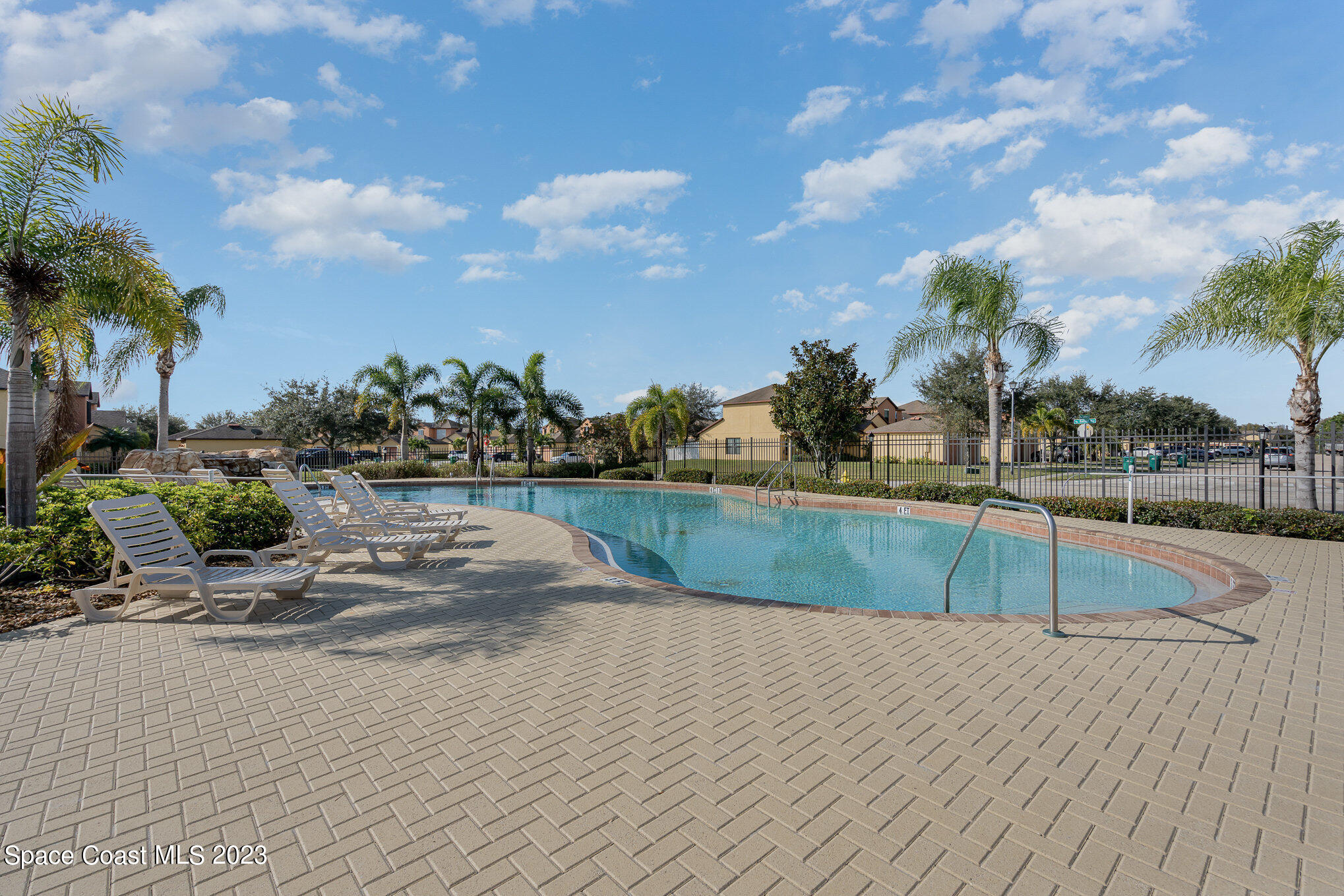 950 Luminary Circle, Unit 103 Melbourne, FL 32901 - Photo 20 of 23 a view of swimming pool with a yard