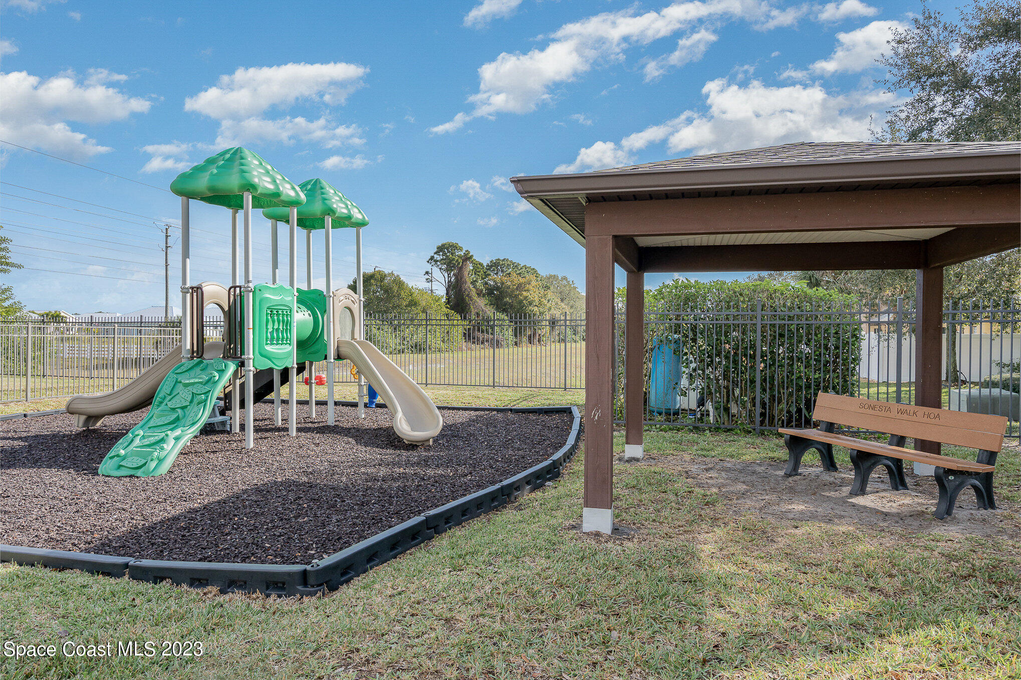 950 Luminary Circle, Unit 103 Melbourne, FL 32901 - Photo 23 of 23 a view of a house with backyard and sitting area
