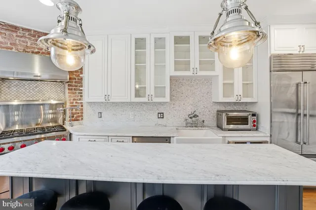 a kitchen with a table and chairs