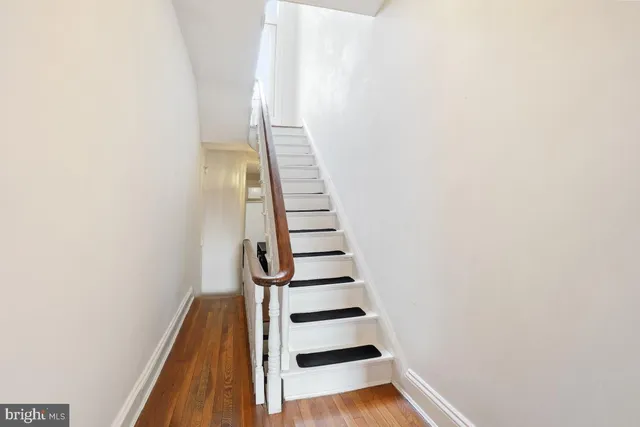 a view of entryway with wooden floor