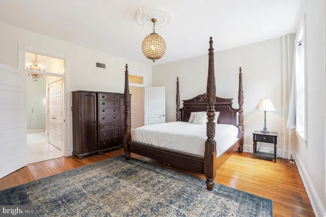 a bed room with bed and window