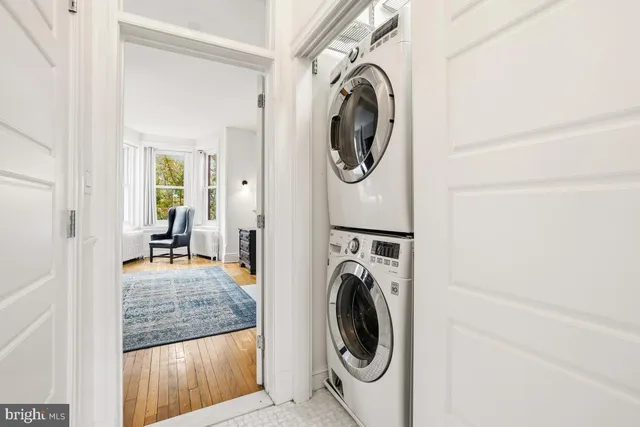 a view of a storage and utility room with washer and dryer
