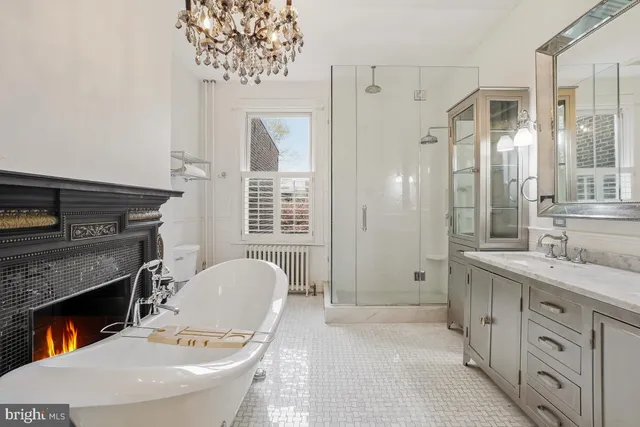 a spacious bathroom with a granite countertop sink toilet and shower