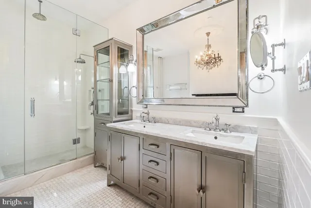 a bathroom with a double vanity sink mirror and double