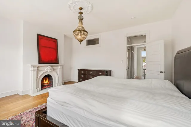 a bed room with a bed and a fireplace