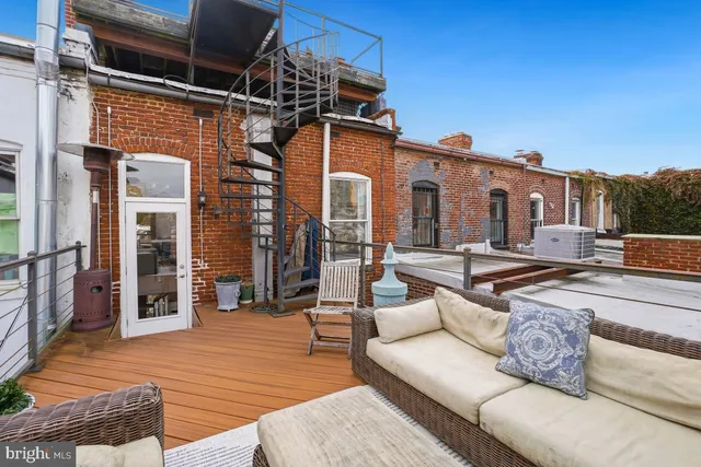 a view of a balcony with furniture