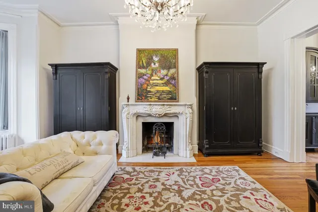 a living room with a couch and a fireplace