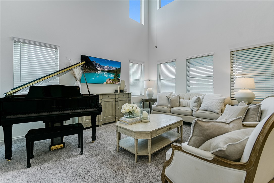 2316 Ringstaff Road Leander, TX 78641 - Photo 1 of 1 a living room with furniture a rug and a fireplace