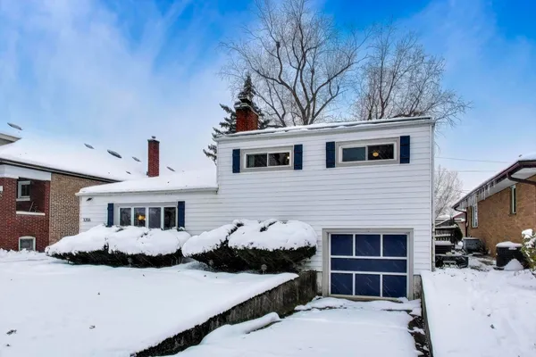 a front view of a house with yard
