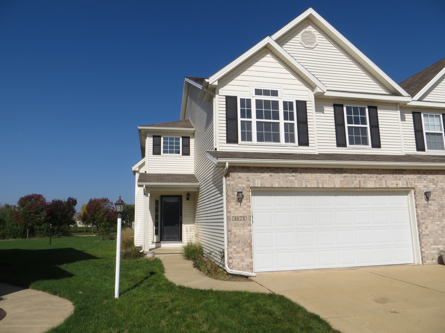 4628 Copper Ridge Road Champaign, IL 61822 - Photo 1 of 1 a front view of a house with a yard and garage