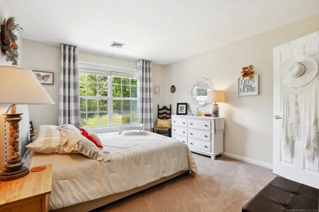 a bed room with a bed and a window