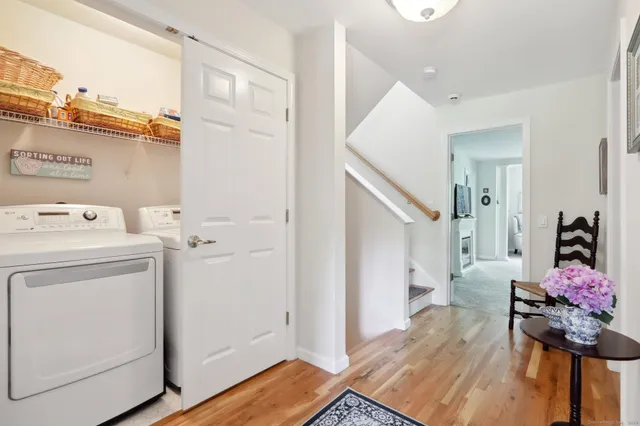 a view of hallway with washer and dryer