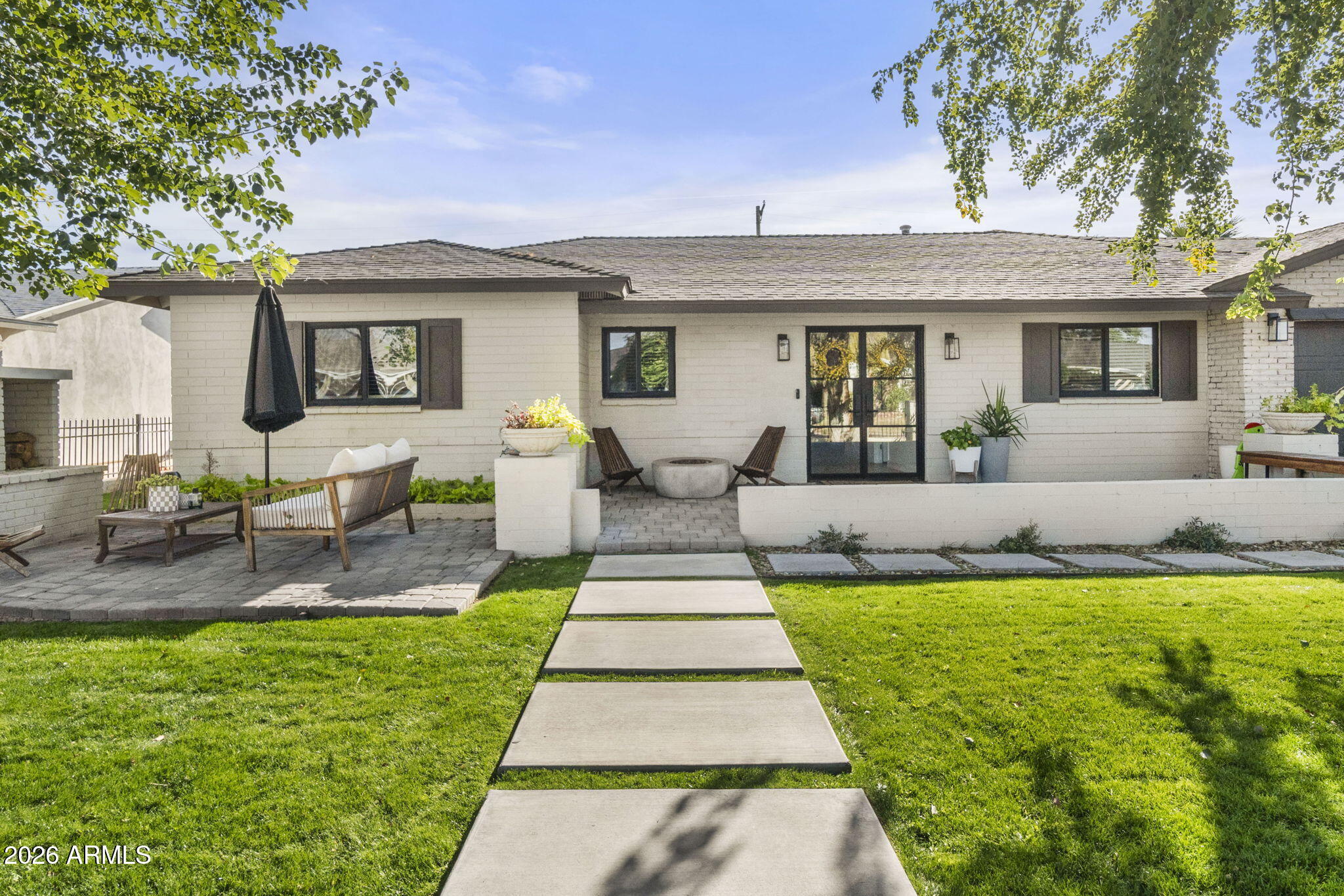 a front view of a house with garden