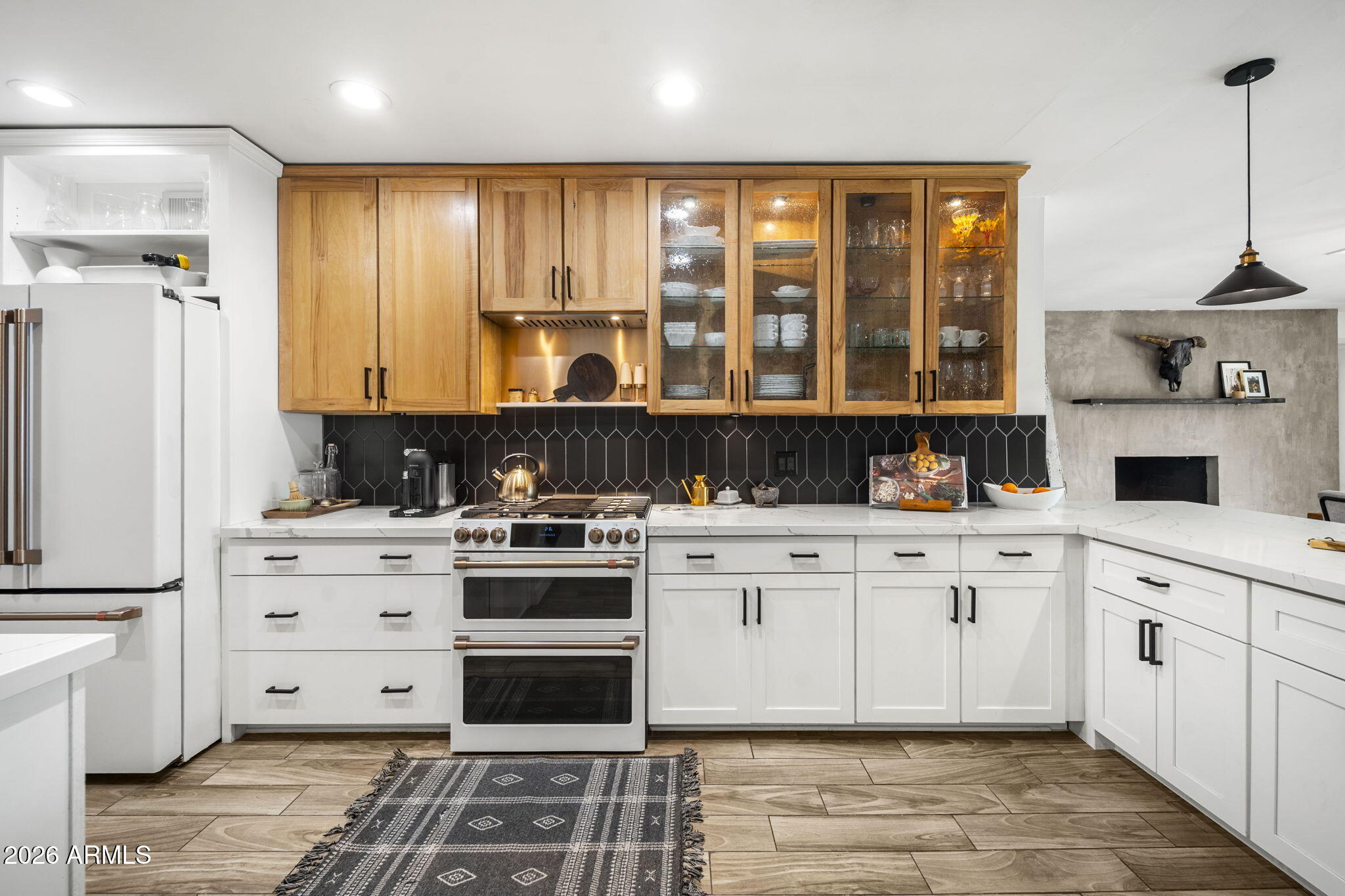 4215 East Flower Street Phoenix, AZ 85018 - Photo 11 of 39 a kitchen with stainless steel appliances granite countertop a stove and cabinets