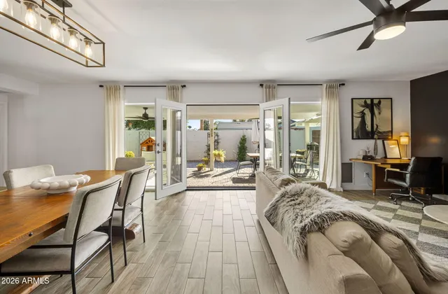 a view of a workspace with furniture and wooden floor