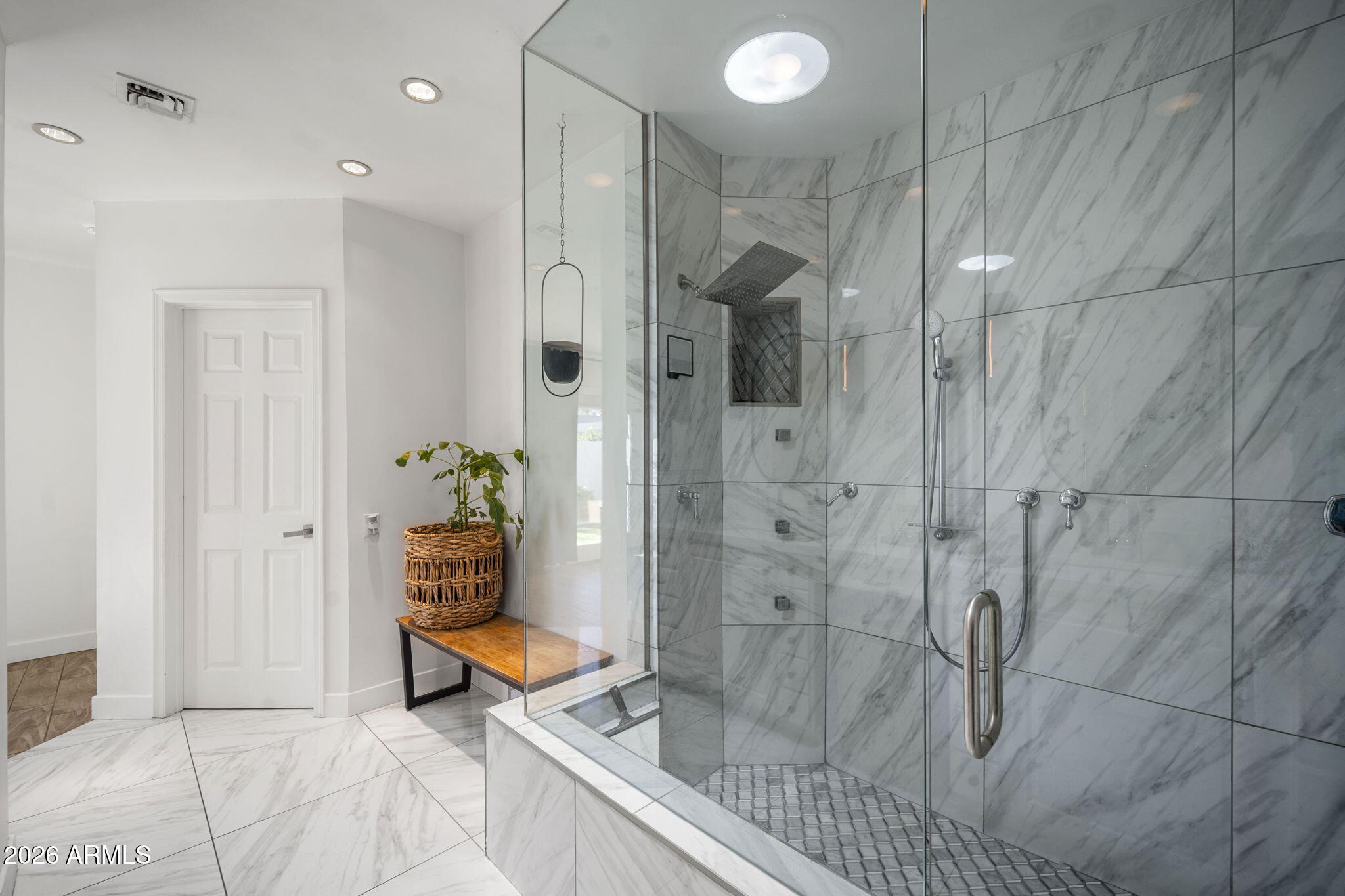 4215 East Flower Street Phoenix, AZ 85018 - Photo 27 of 39 a bathroom with a shower and a bath tub