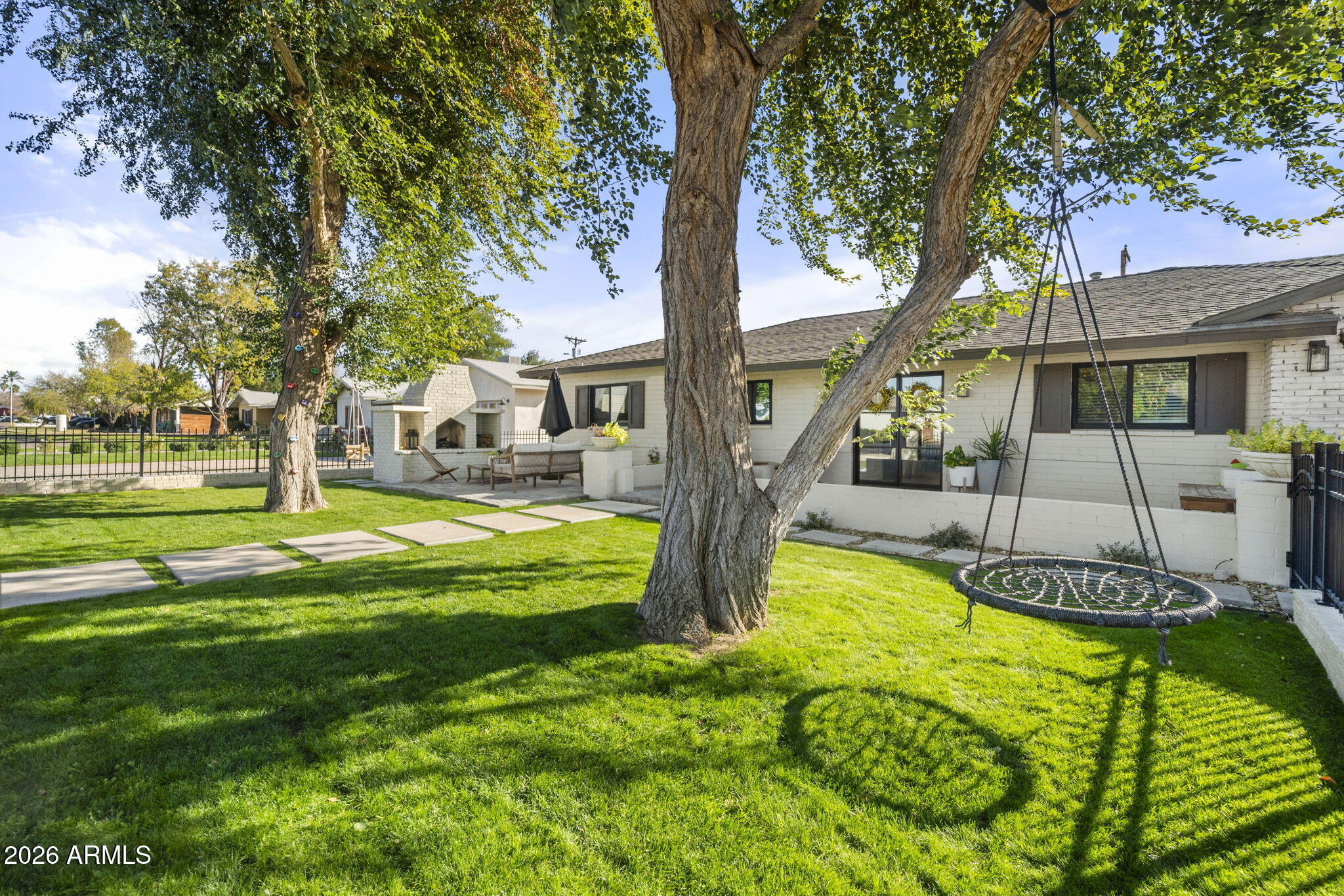 4215 East Flower Street Phoenix, AZ 85018 - Photo 3 of 39 a swimming pool with yard and outdoor seating