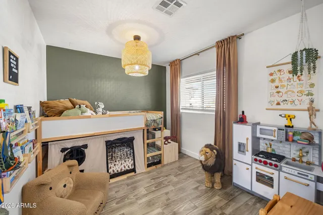 a bedroom with a bed and a window