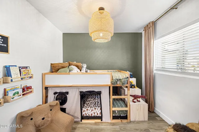 a bedroom with furniture and a window