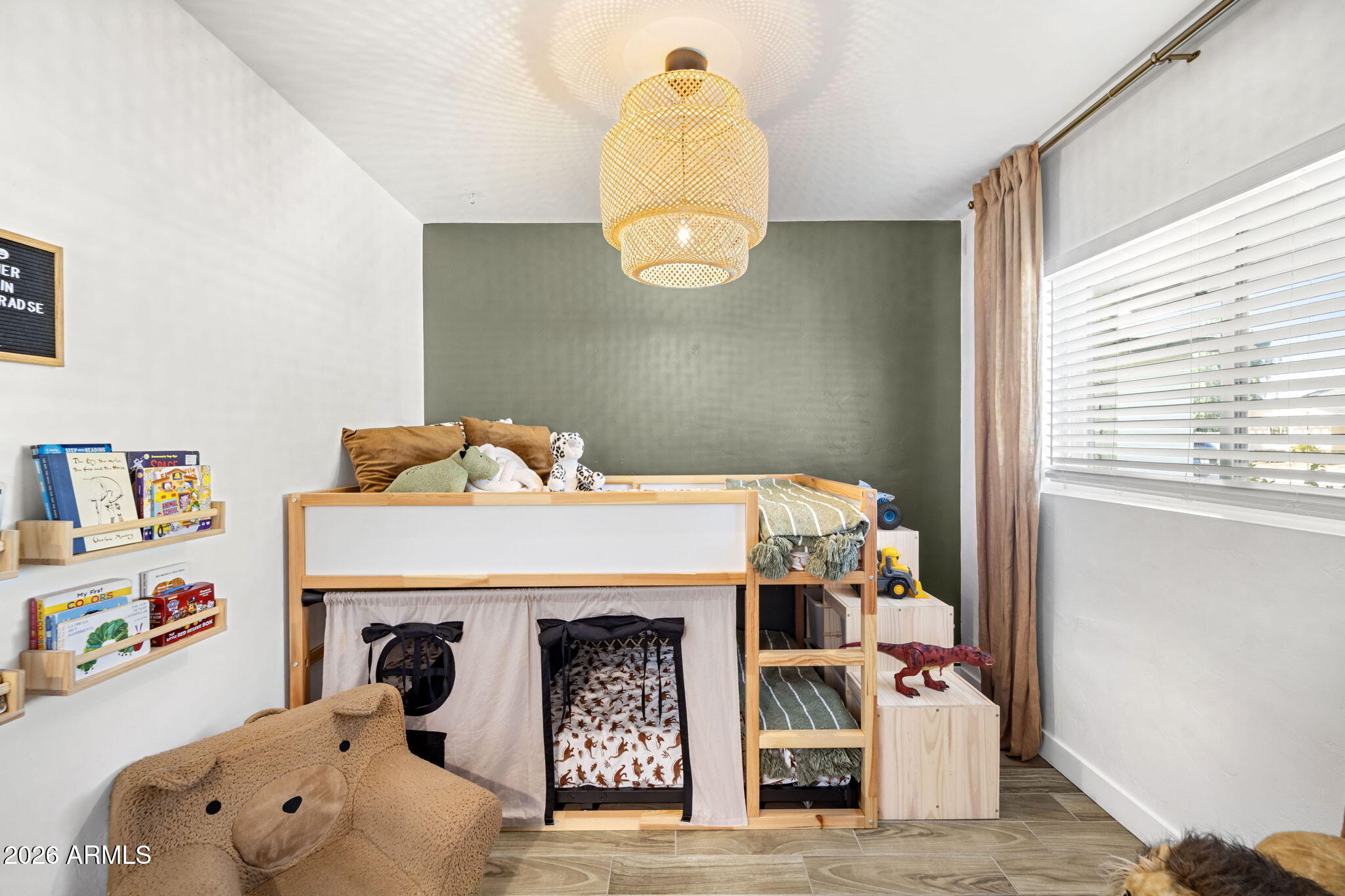 4215 East Flower Street Phoenix, AZ 85018 - Photo 32 of 39 a bedroom with a bed and a window