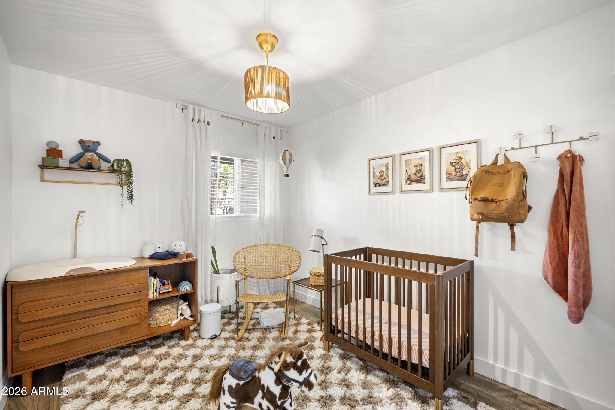 4215 East Flower Street Phoenix, AZ 85018 - Photo 33 of 39 a bedroom with furniture and a window