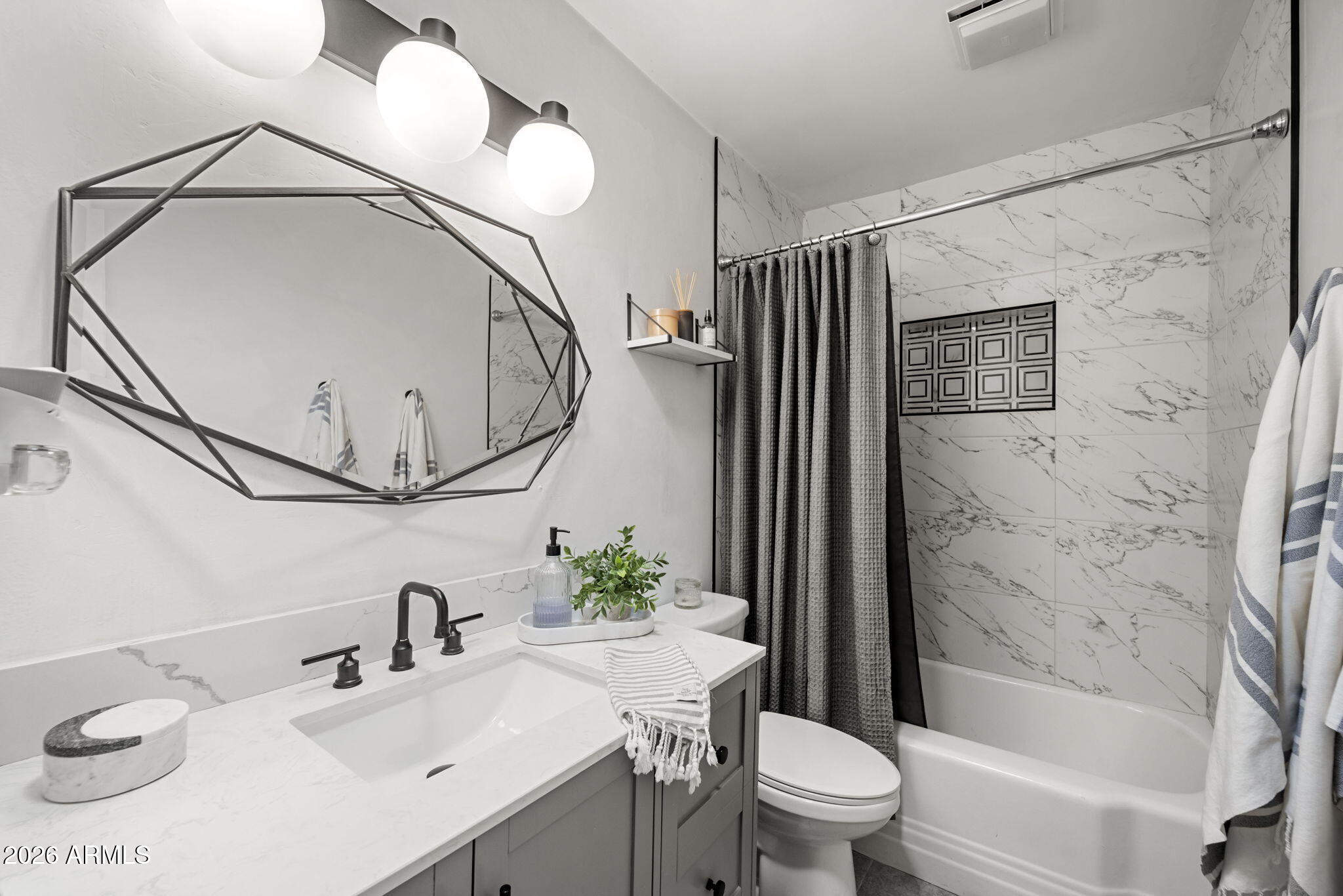 4215 East Flower Street Phoenix, AZ 85018 - Photo 35 of 39 a bathroom with a sink a toilet and shower