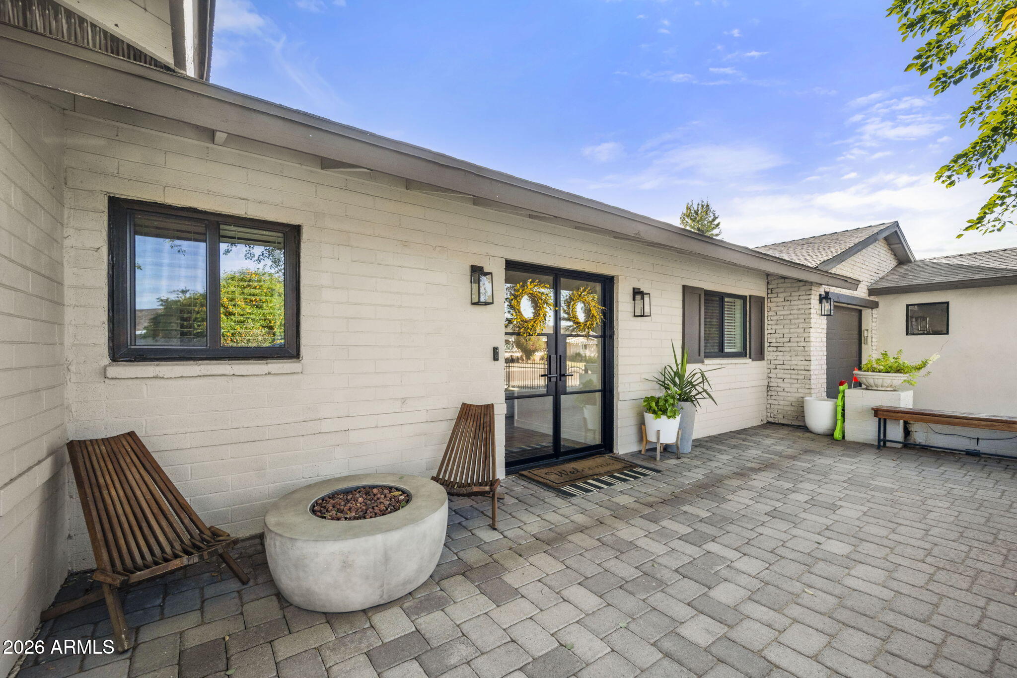 4215 East Flower Street Phoenix, AZ 85018 - Photo 6 of 39 a view of a patio with couple of chairs and a couch