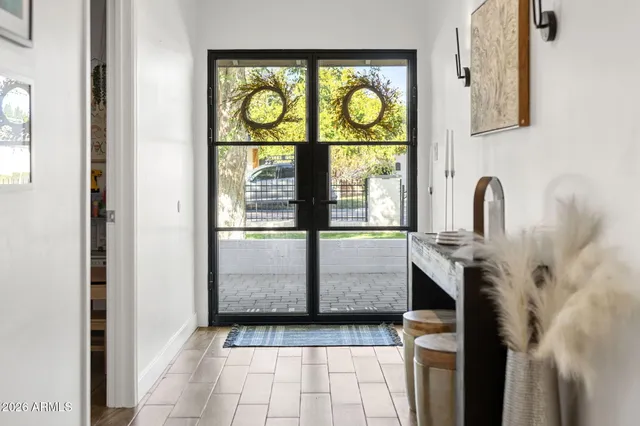a living room with a couch and a chandelier