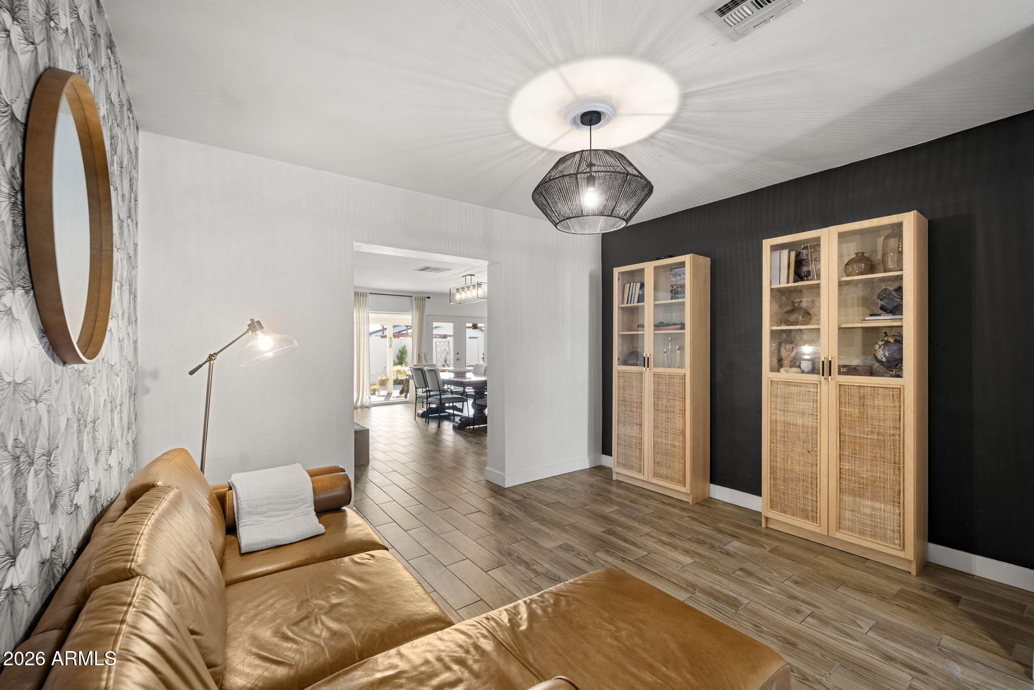 4215 East Flower Street Phoenix, AZ 85018 - Photo 9 of 39 a living room with furniture and a chandelier