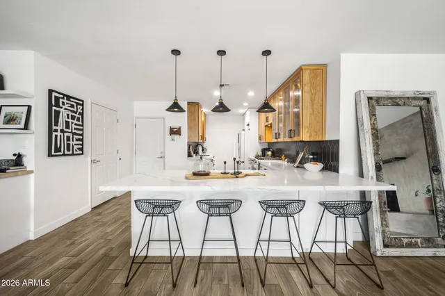 a kitchen with stainless steel appliances granite countertop a stove and cabinets