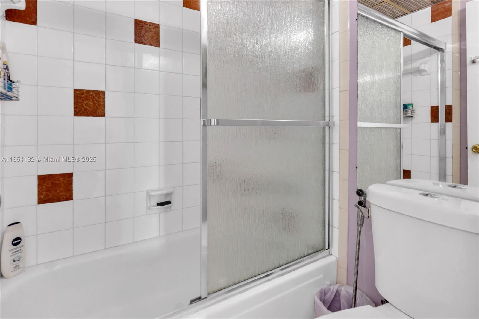 1855 West 62nd Street, Unit E306 Hialeah, FL 33012 - Photo 13 of 35 a bathroom with a shower and a sink