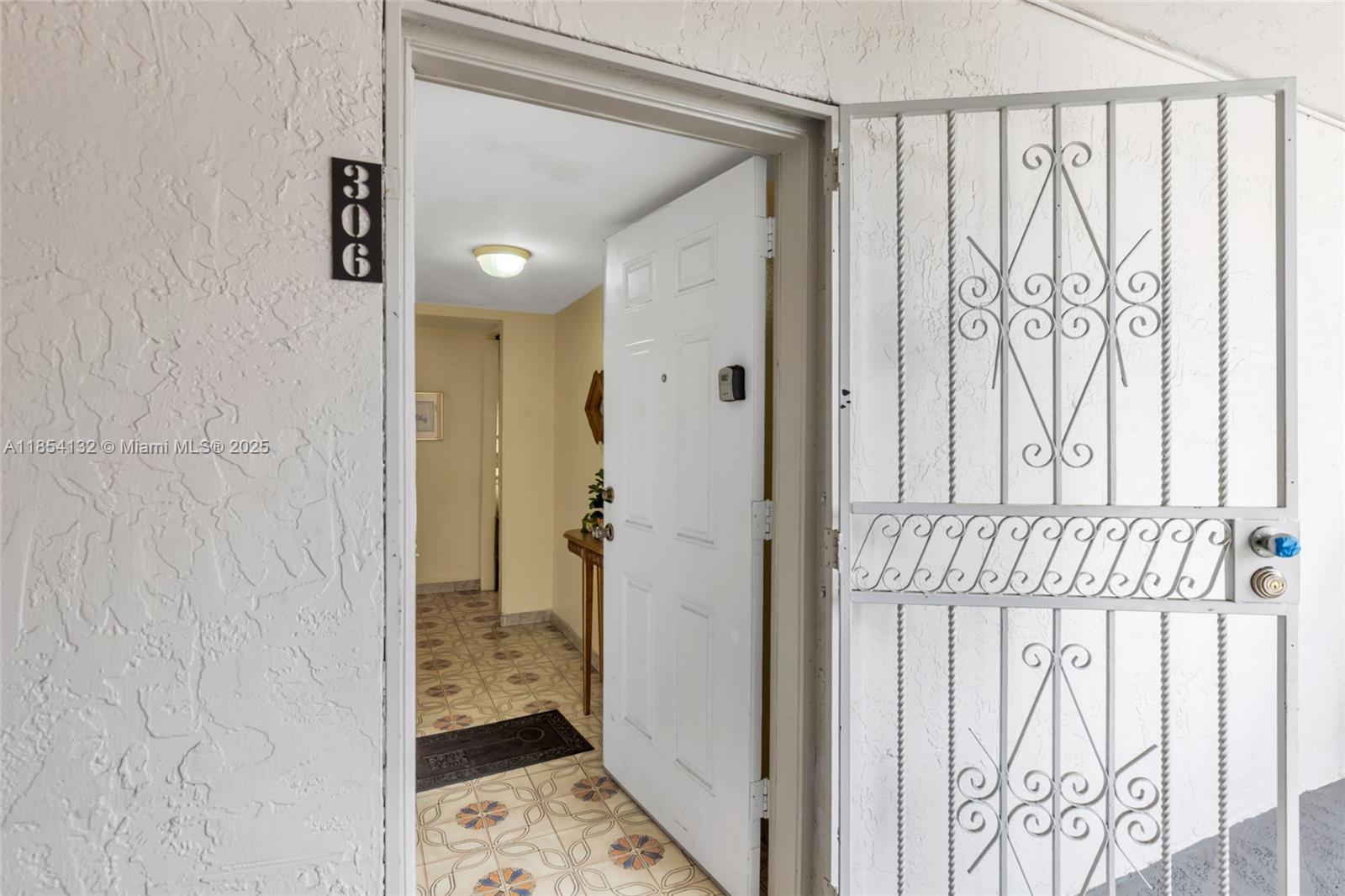 1855 West 62nd Street, Unit E306 Hialeah, FL 33012 - Photo 18 of 35 a bathroom with a shower