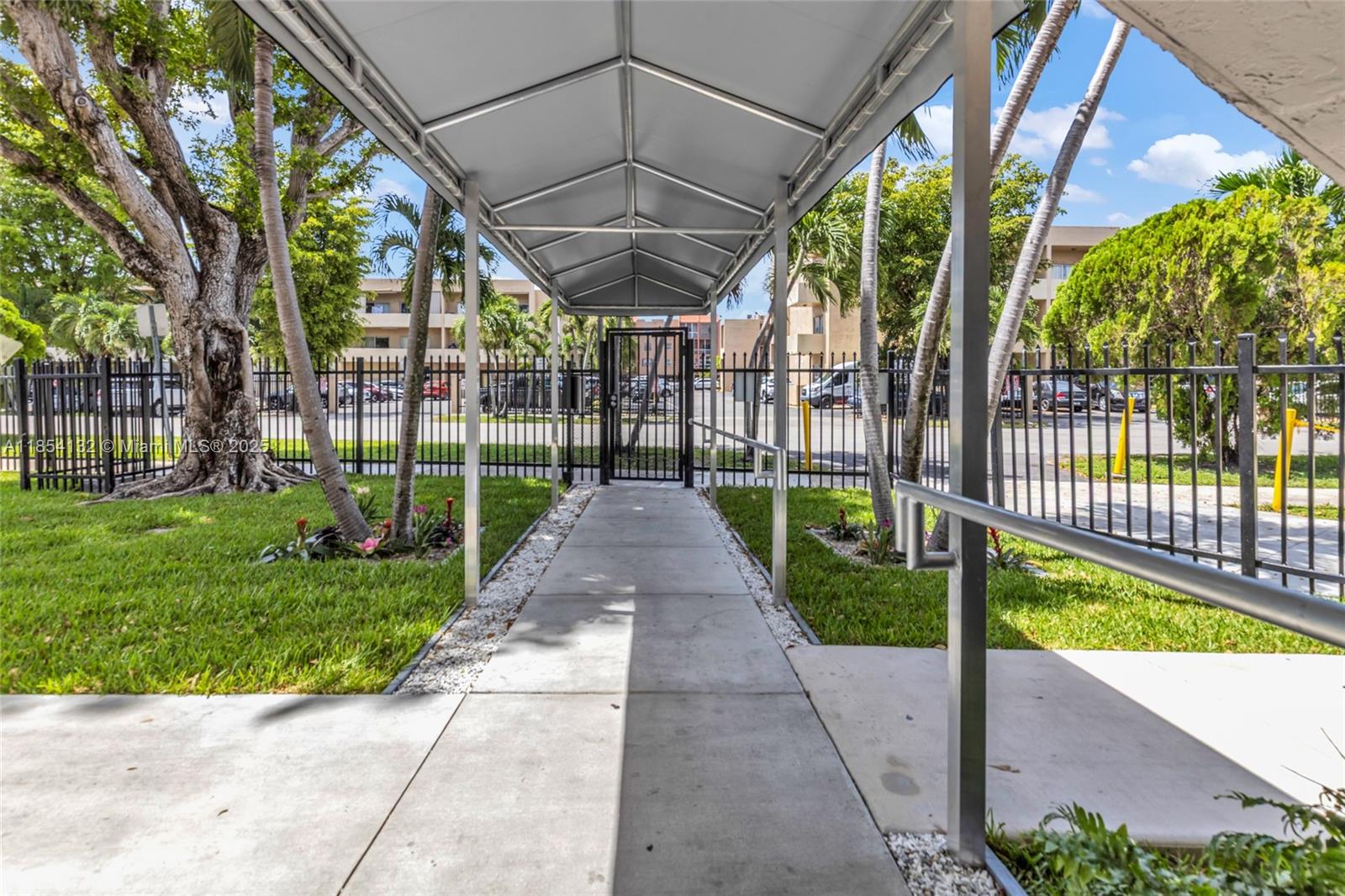 1855 West 62nd Street, Unit E306 Hialeah, FL 33012 - Photo 24 of 35 a view of a backyard with garden