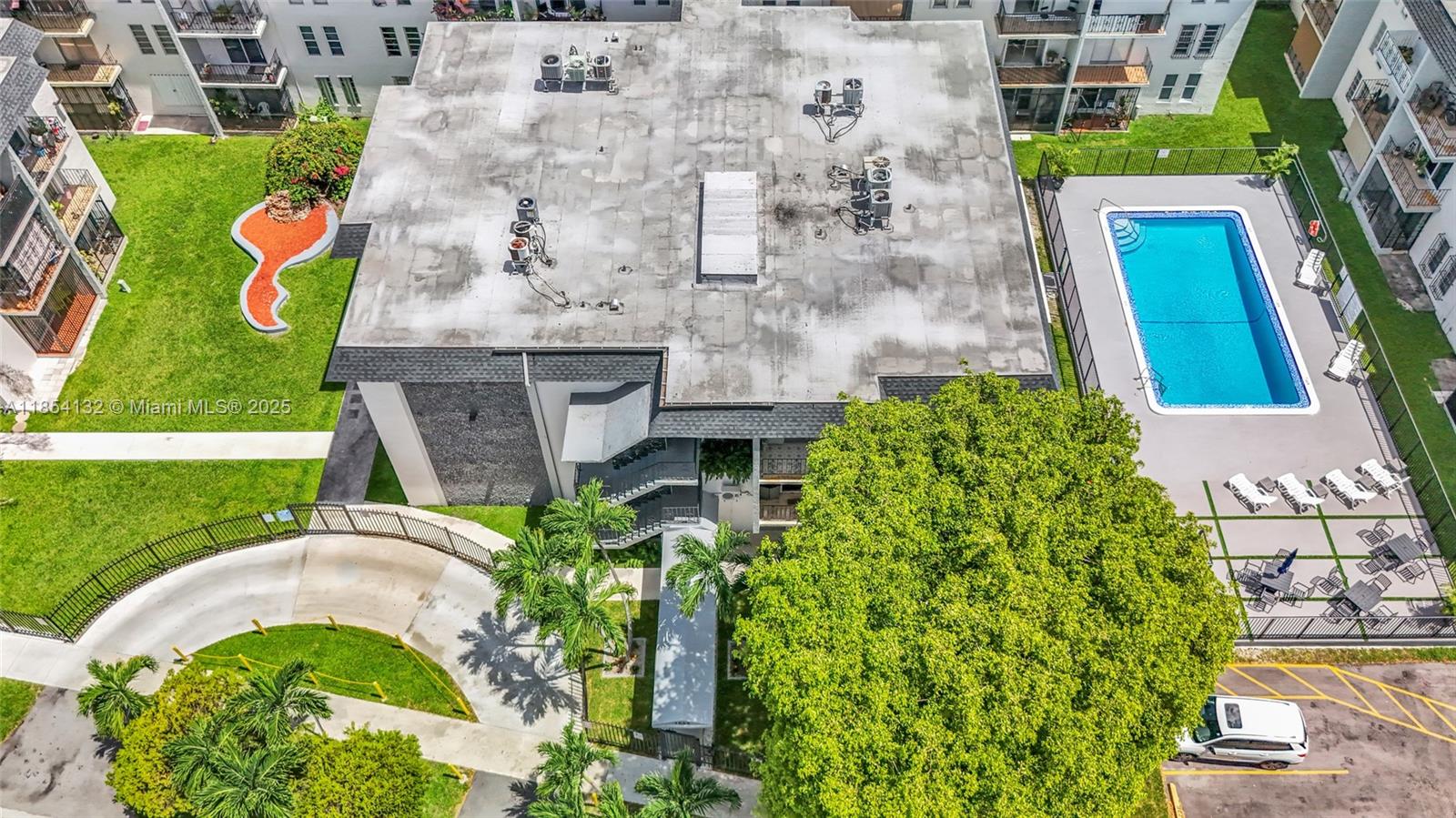 1855 West 62nd Street, Unit E306 Hialeah, FL 33012 - Photo 31 of 35 a aerial view of a house