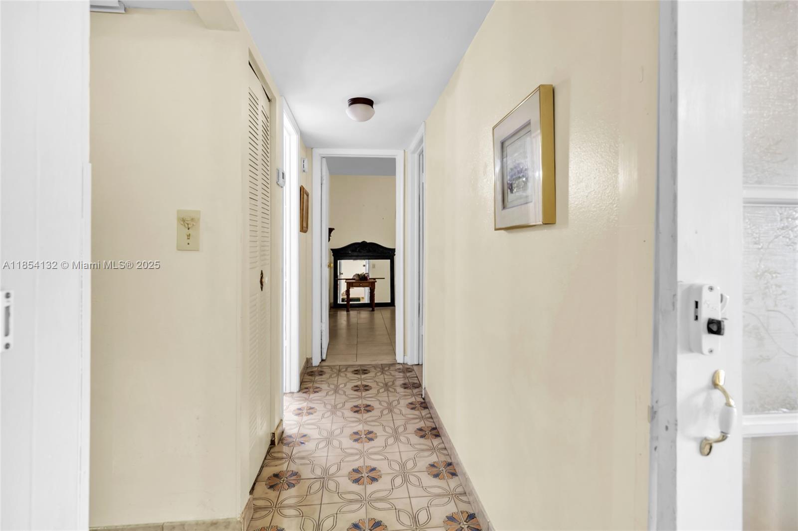 1855 West 62nd Street, Unit E306 Hialeah, FL 33012 - Photo 7 of 35 a view of hallway with bathroom and a shower