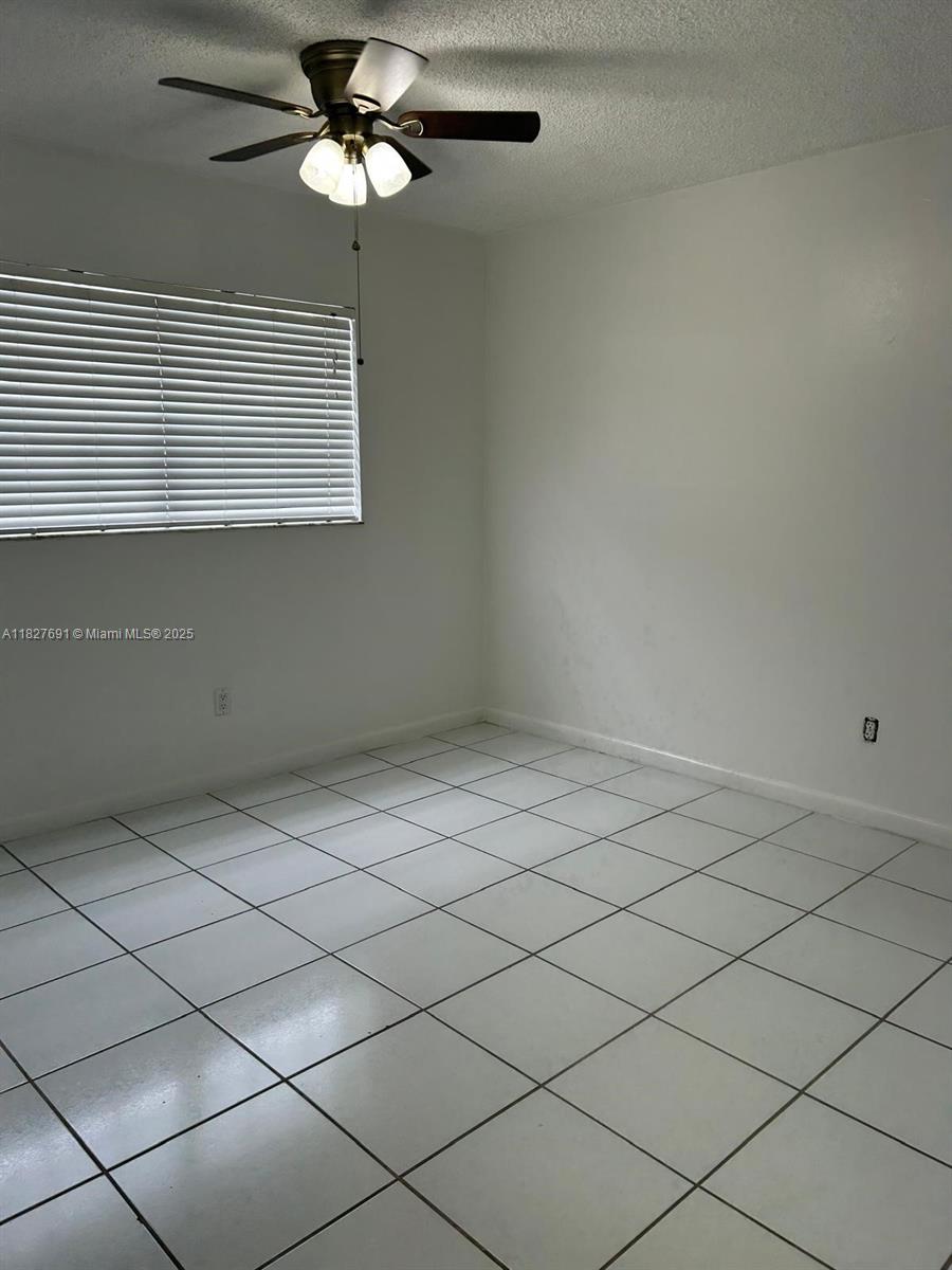 6125 West 20th Avenue, Unit 217 Hialeah, FL 33012 - Photo 11 of 16 a view of an empty room with a window