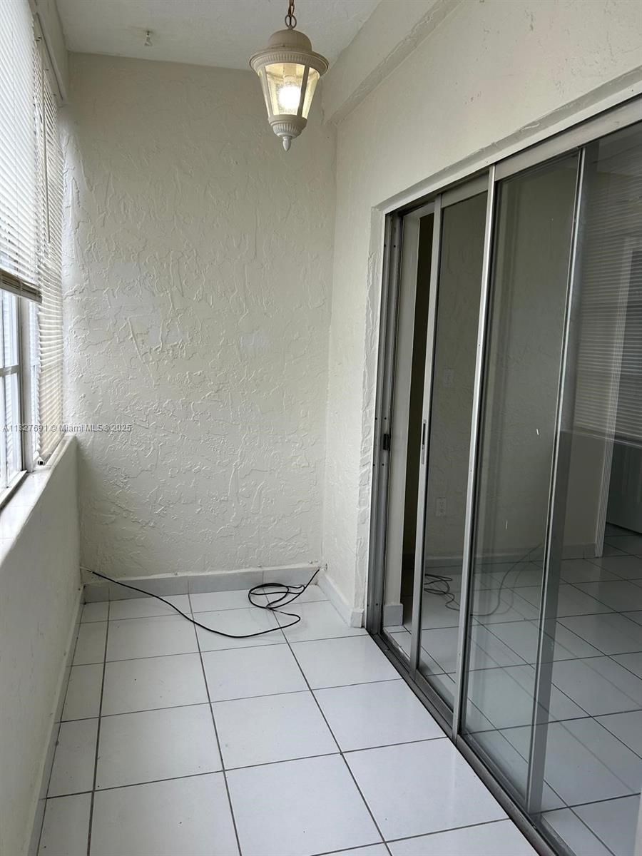 6125 West 20th Avenue, Unit 217 Hialeah, FL 33012 - Photo 12 of 16 a view of an empty room