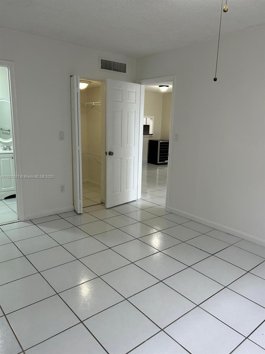 6125 West 20th Avenue, Unit 217 Hialeah, FL 33012 - Photo 13 of 16 a view of a hallway