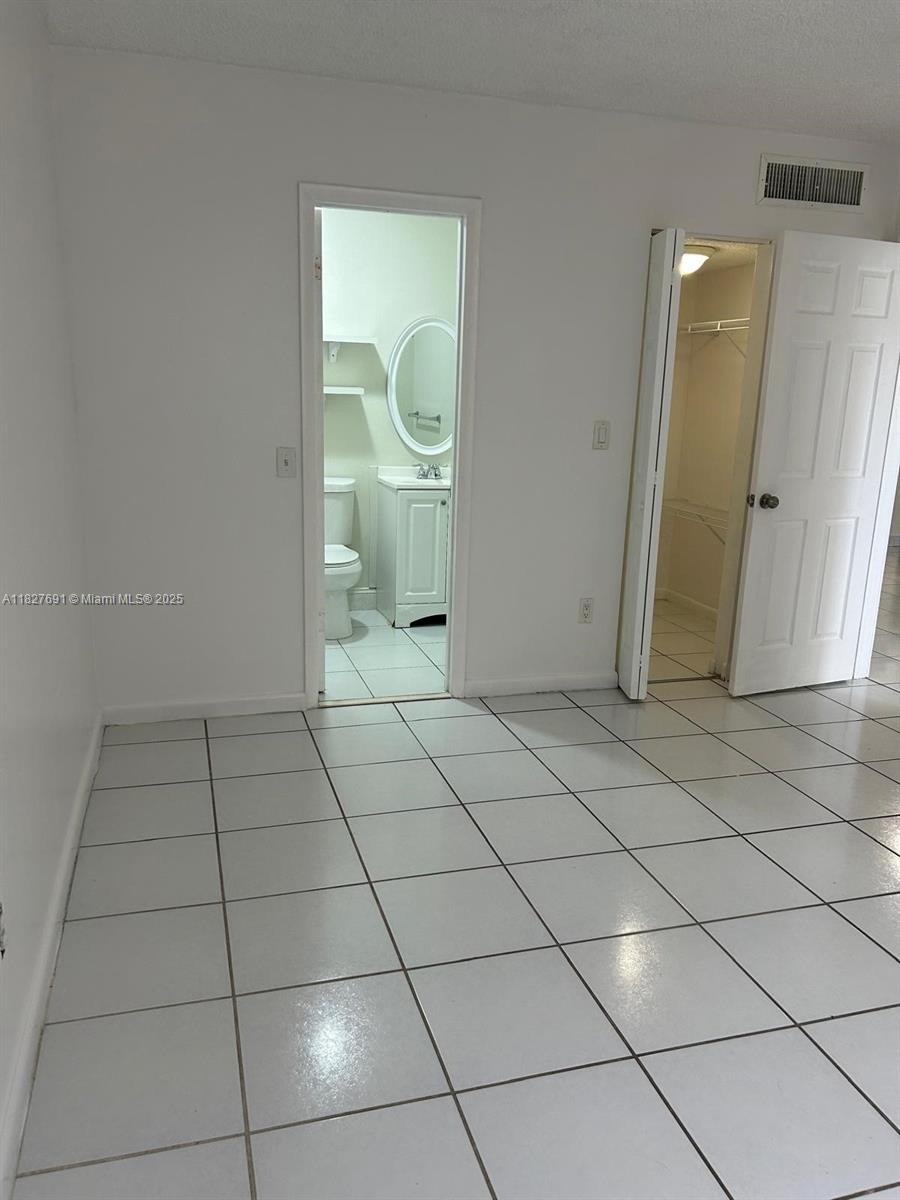 6125 West 20th Avenue, Unit 217 Hialeah, FL 33012 - Photo 14 of 16 a view of a livingroom with wooden floor