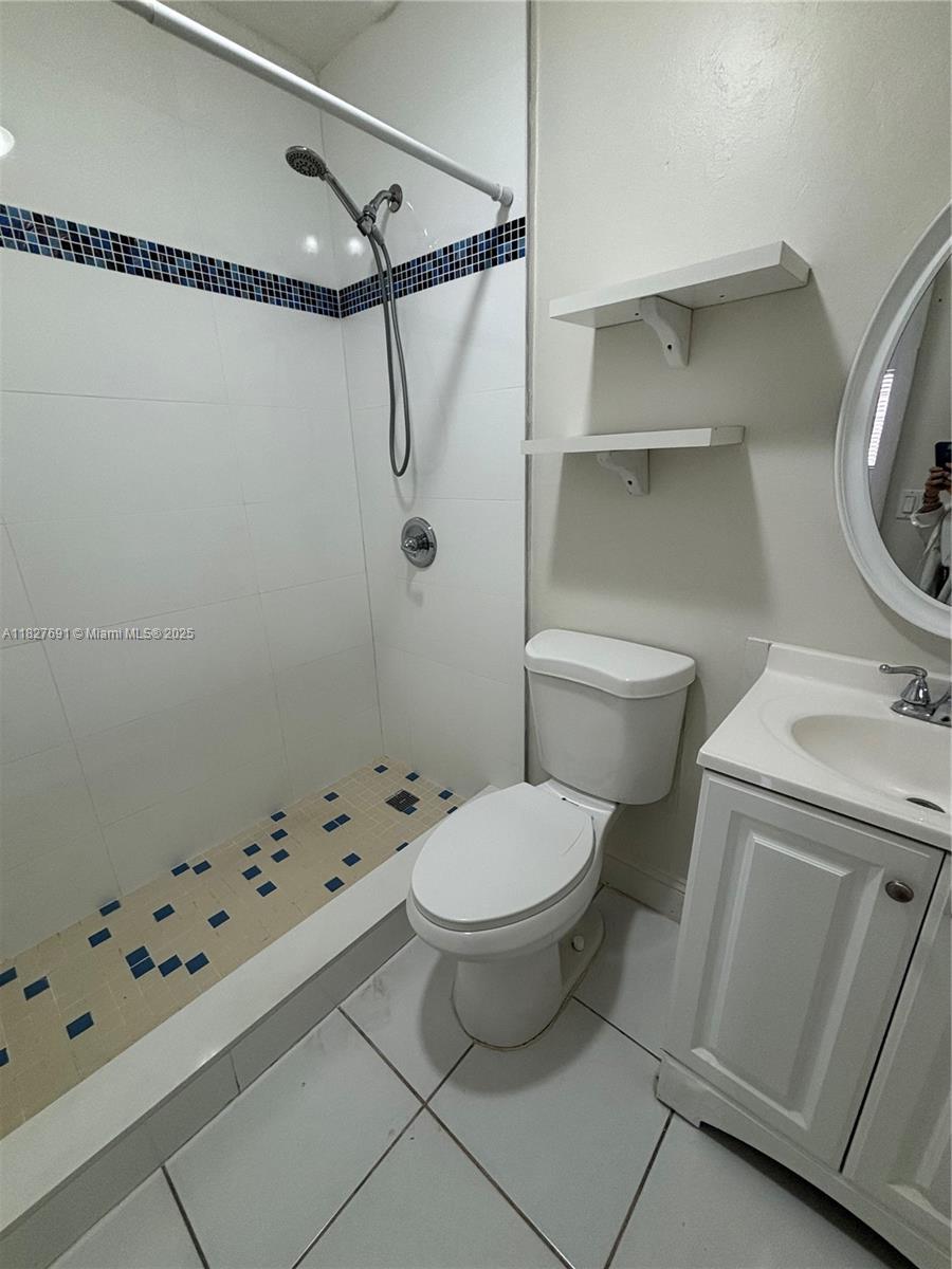 6125 West 20th Avenue, Unit 217 Hialeah, FL 33012 - Photo 16 of 16 a bathroom with a toilet and a shower