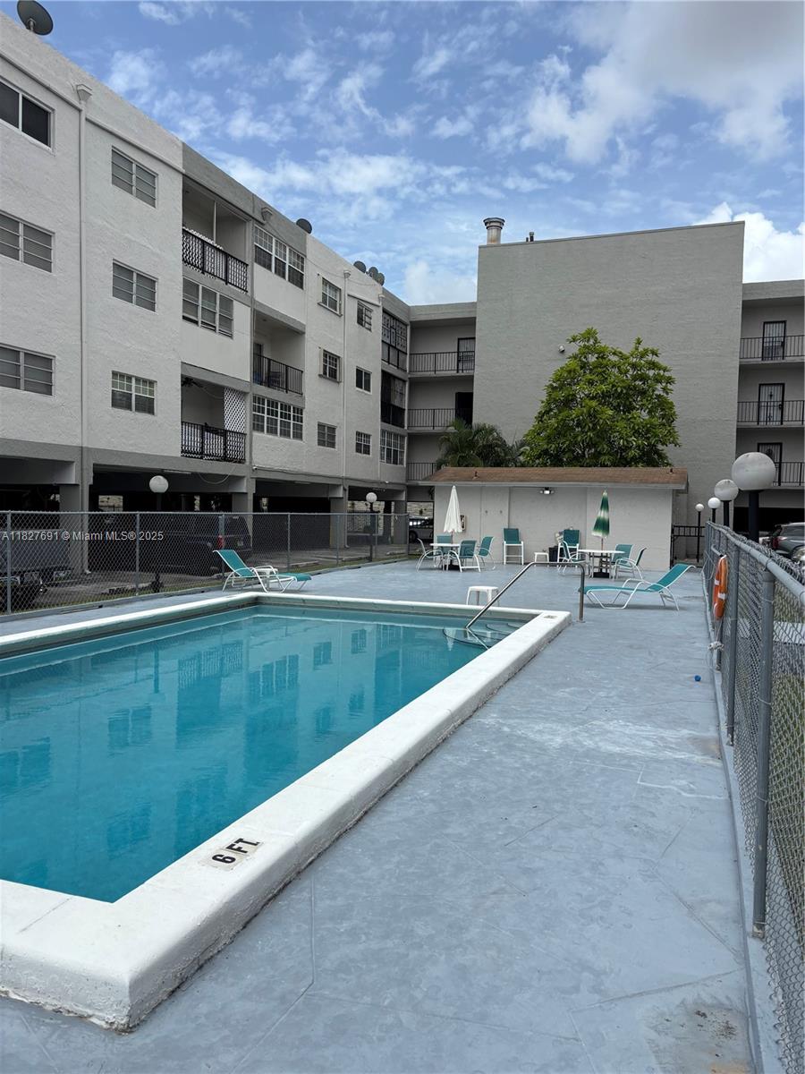 6125 West 20th Avenue, Unit 217 Hialeah, FL 33012 - Photo 2 of 16 a view of building and yard