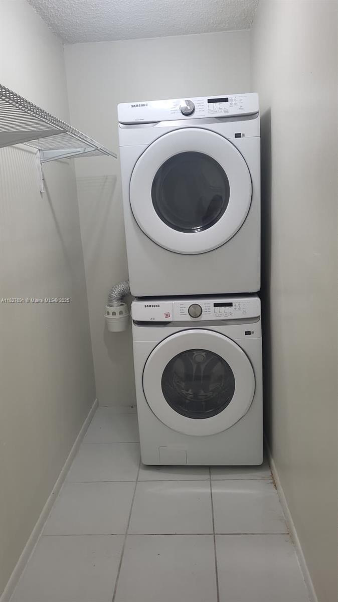 6125 West 20th Avenue, Unit 217 Hialeah, FL 33012 - Photo 5 of 16 a utility room with dryer and washer