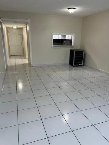a view of a livingroom with kitchen