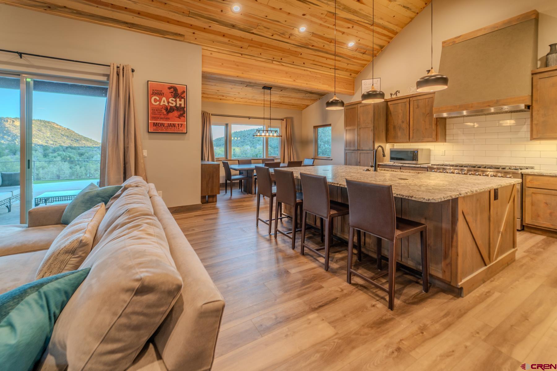 1700 Thoroughbred Road Durango, CO 81303 - Photo 11 of 45 a view of a dining room with furniture window and wooden floor