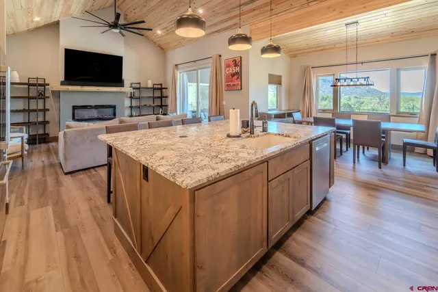 a view of kitchen with sink microwave and stove