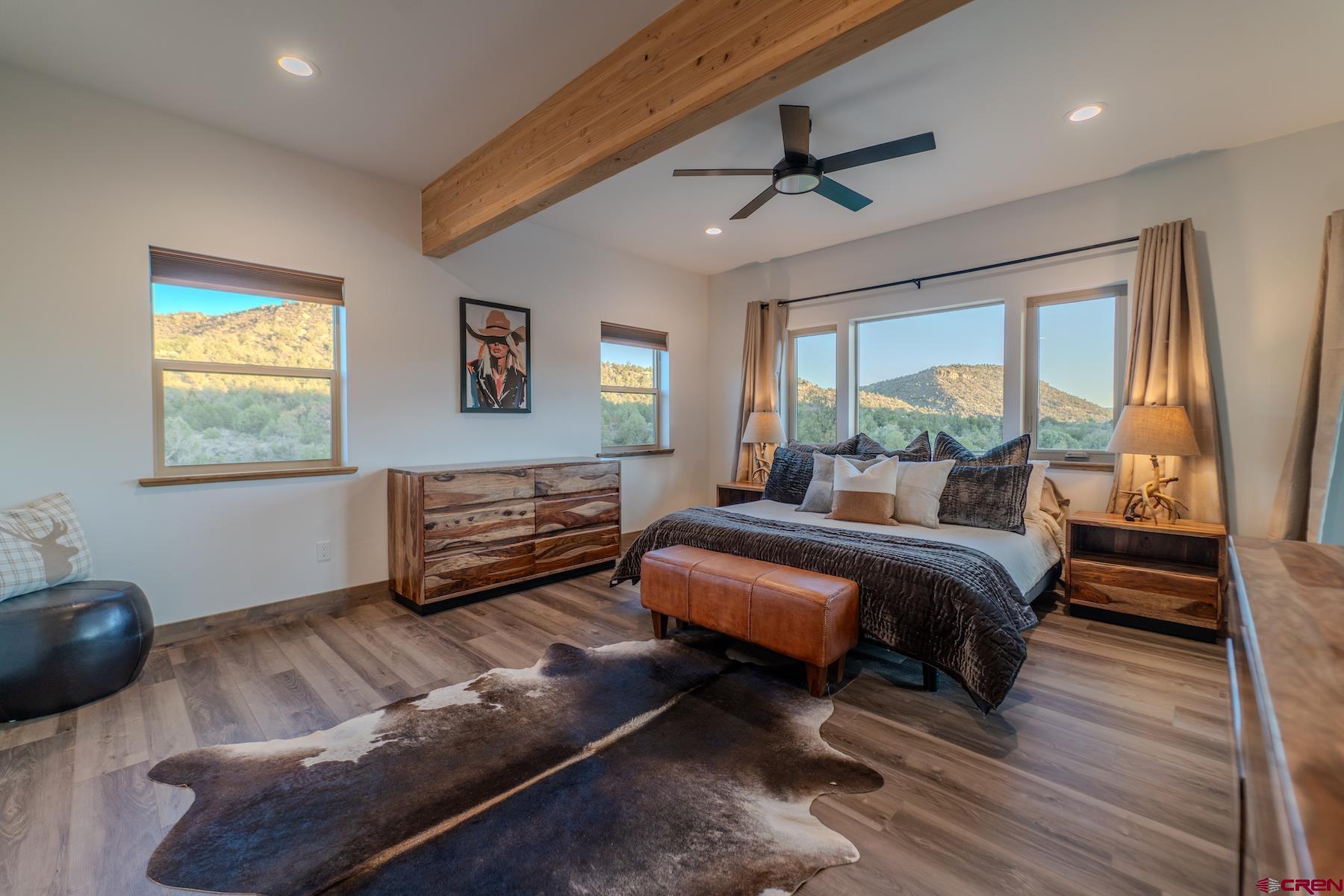 1700 Thoroughbred Road Durango, CO 81303 - Photo 19 of 45 a bedroom with furniture and a large window